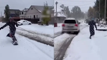 Мужчина в халате катался на привязанном к машине сноуборде в Павлодаре (ВИДЕО)